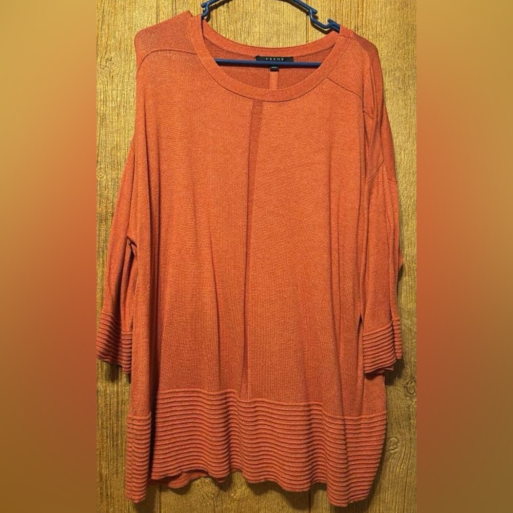 Cyrus shirt. Size 2x and color orange.